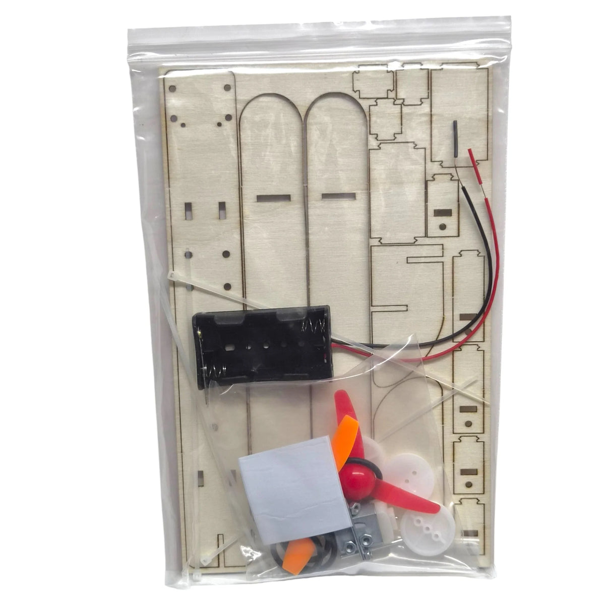 Piezas del kit de avión eléctrico: madera, ruedas, motor, portapilas y hélice